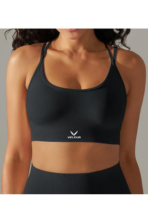 Veleur CrissCross Bra, nahtloser Sport-BH für Damen mit überkreuzten, verstellbaren Trägern, atmungsaktiv und bequem, ideal für Training und Alltag.